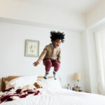 Joyful Leaps: A Ballet of Laughter in a Toddler’s Haven